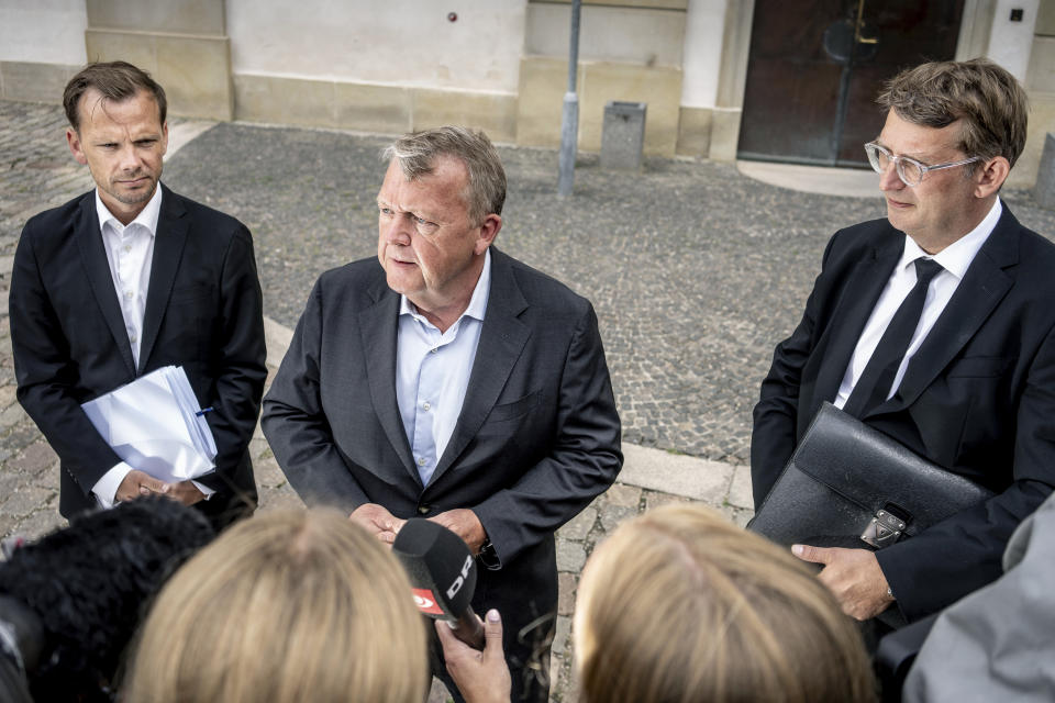 FILE - Denmark's Minister of Foreign Affairs Lars Loekke Rasmussen, centre, Minister of Justice Peter Hummelgaard, left and acting Minister of Defense Troels Lund Poulsen address the media after a briefing by members of the Danish Parliament on the international reactions to the Quran burnings, in Copenhagen, Monday, July 31, 2023. Denmark's government on Friday, Aug. 25, 2023. said it would present a law proposal that would make it illegal to desecrate the Quran or other religious holy books in the Scandinavian country that has a recent string of public desecrations by a handful of anti-Islam activists — protests that have sparked angry demonstrations in Muslim countries. (Mads Claus Rasmussen /Ritzau Scanpix via AP, File)