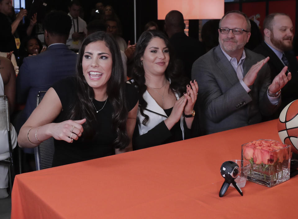 Kelsey Plum, left, reacts after being announced as the No. 1 pick in the WNBA basketball draft by the San Antonio Stars, Thursday, April 13, 2017, in New York. (AP Photo/Julie Jacobson)