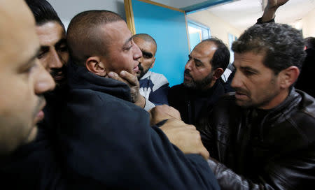 A relative of Palestinian man Omar Awad reacts in a hospital in Hebron in the occupied West Bank December 11, 2018. REUTERS/Mussa Qawasma