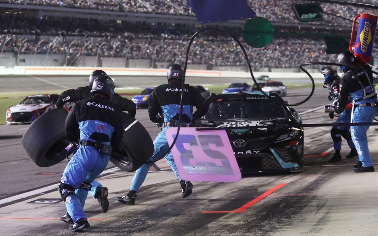 Bubba Wallace brings his No. 23 Toyota in for service Saturday, August 26, 2023 during the Coke Zero Sugar 400 at Daytona International Speedway.