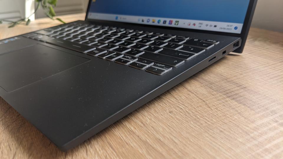 The MSI Prestige 13 Evo ultrabook pictured on a wooden desk.