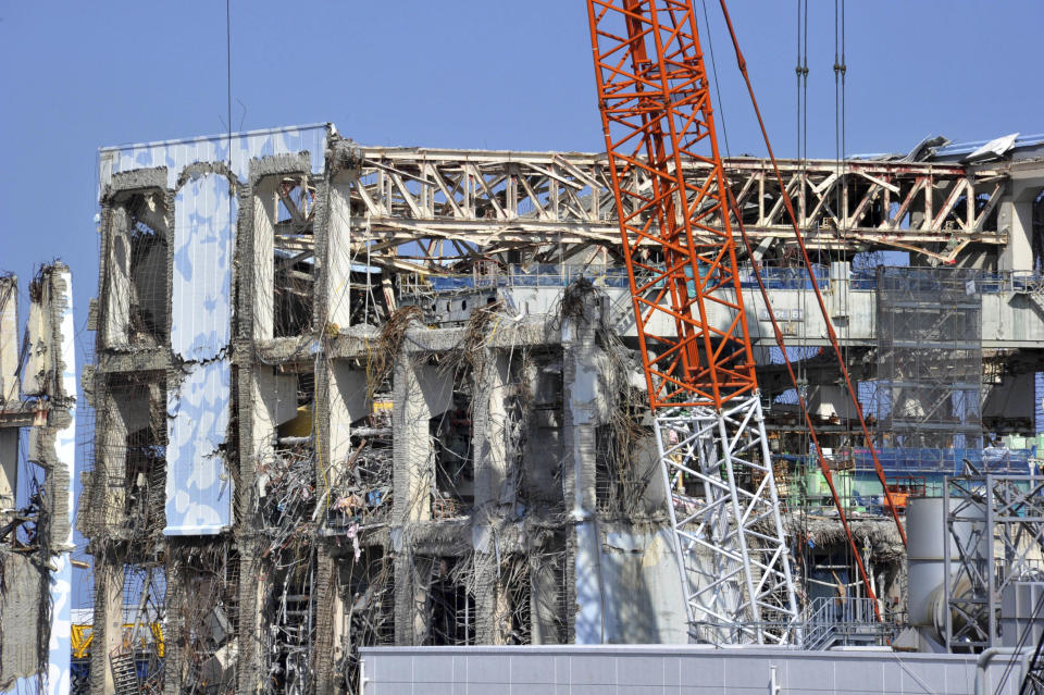 Crippled Unit 4 reactor building of Tokyo Electric Power Co., Fukushima Dai-ichi nuclear power plant is seen in Okuma town,  Fukushima prefecture, northeastern Japan Tuesday, Feb. 28, 2012. Japan next month marks one year since the March 11 tsunami and earthquake, which triggered the worst nuclear accident since Chernobyl in 1986.  (AP Photo/Yoshikazu Tsuno, Pool)