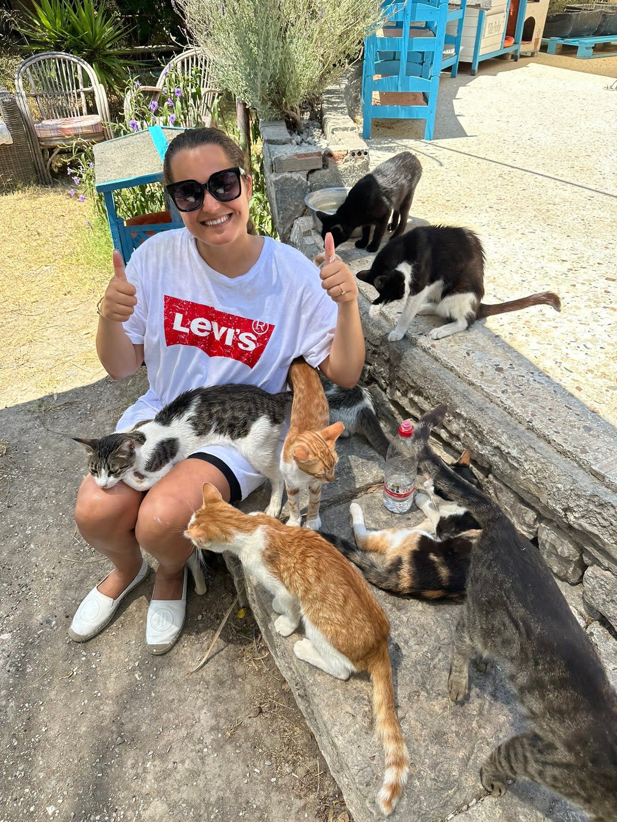 London sales director Jasmine, 31, who is helping teams from Greek Cat Rescue Samos to clear debris to prevent any more wildfires in Greece (Jasmine)