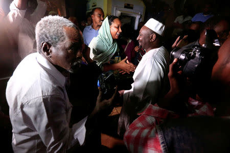 Supporters congratulate journalists after their release outside National Prison, after demonstrations in Khartoum, Sudan February 18, 2018. REUTERS/Mohamed Nureldin Abdallah