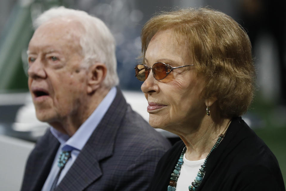 FILE - Former President Jimmy Carter, left, and his wife, former first lady Rosalynn Carter, are seen ahead of an NFL football game between the Atlanta Falcons and the Cincinnati Bengals, Sept. 30, 2018, in Atlanta. Rosalynn Carter, the closest adviser to Jimmy Carter during his one term as U.S. president and their four decades thereafter as global humanitarians, died Sunday, Nov. 19, 2023. She was 96. (AP Photo/John Bazemore, File)