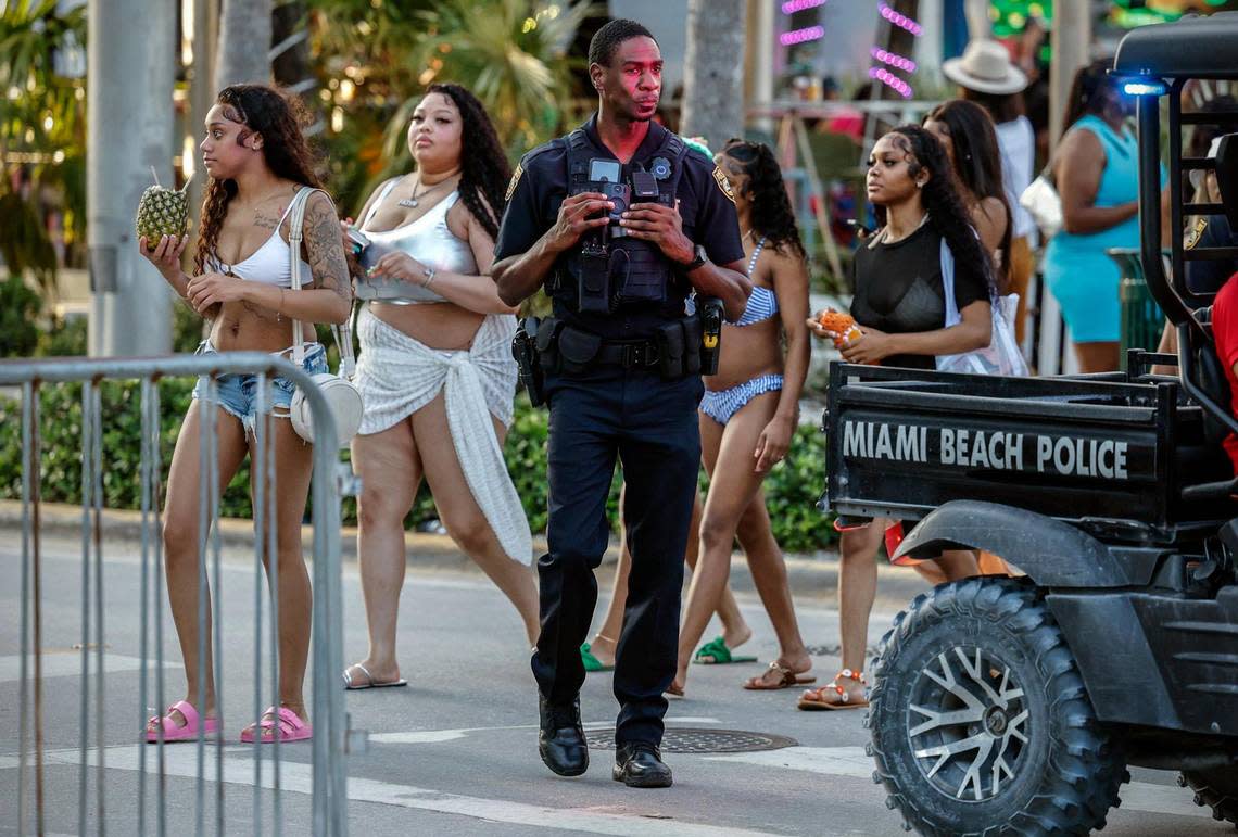 Miami Beach police officer White patrols along Ocean Drive during spring break on Miami Beach, Florida on Sunday, March 17, 2024.