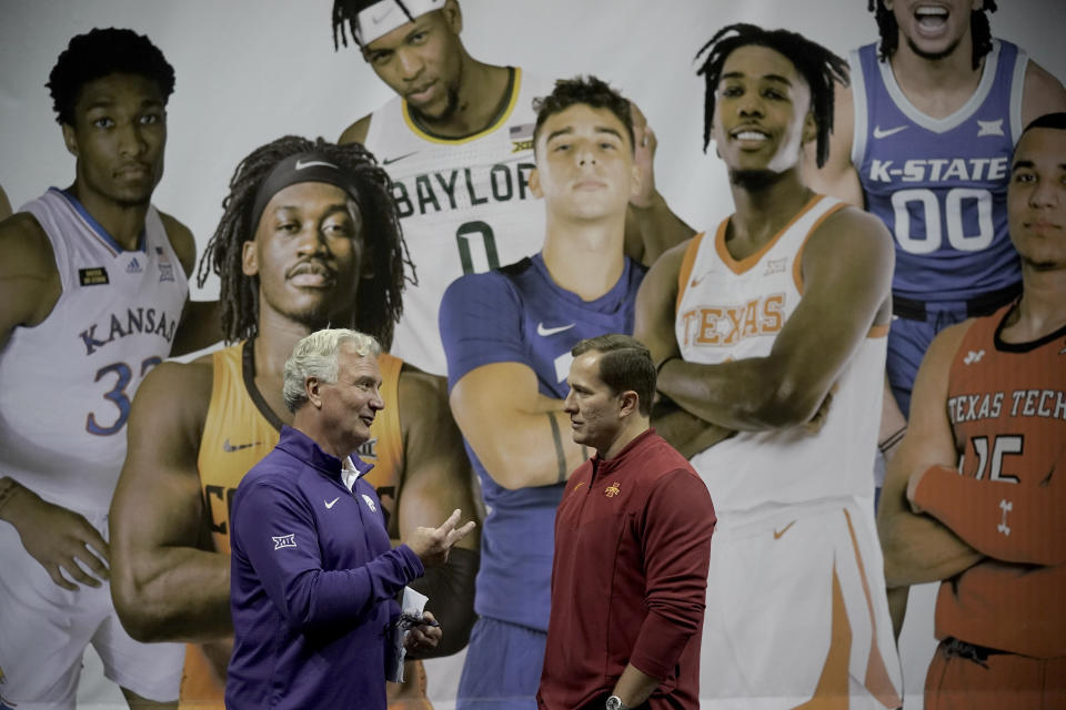 Kansas State coach Bruce Weber, left, and Iowa State coach T.J. Otzelberger talk during Big 12 NCAA college basketball media day Wednesday, Oct. 20, 2021, in Kansas City, Mo. (AP Photo/Charlie Riedel)