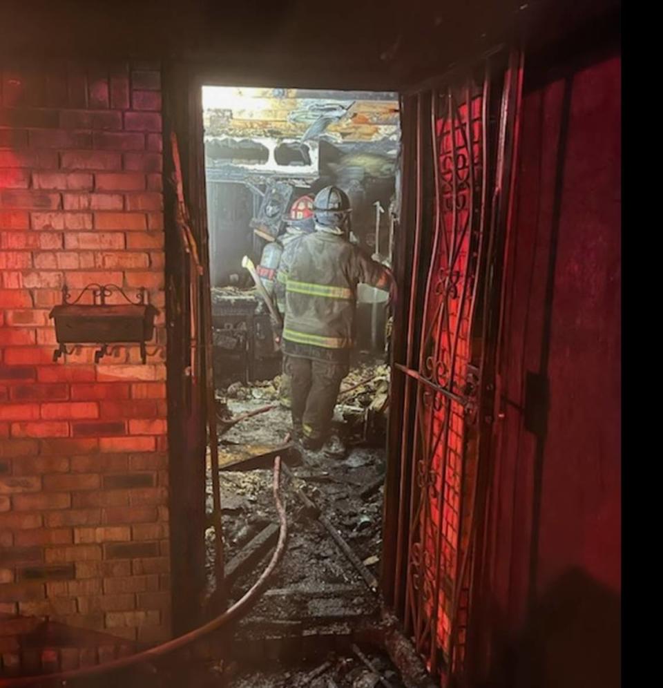 A fire destroyed a home in southeast Fort Worth, fire officials said. Firefighters rescued seven people who were trapped inside.