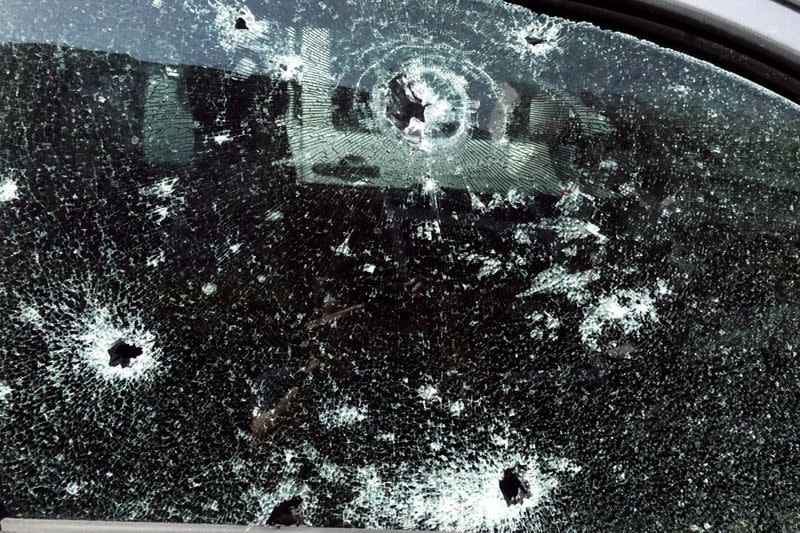 Bullet holes are pictured on the window of a victim's car following a gun battle involving a Thai soldier on a shooting rampage, in Nakhon Ratchasima