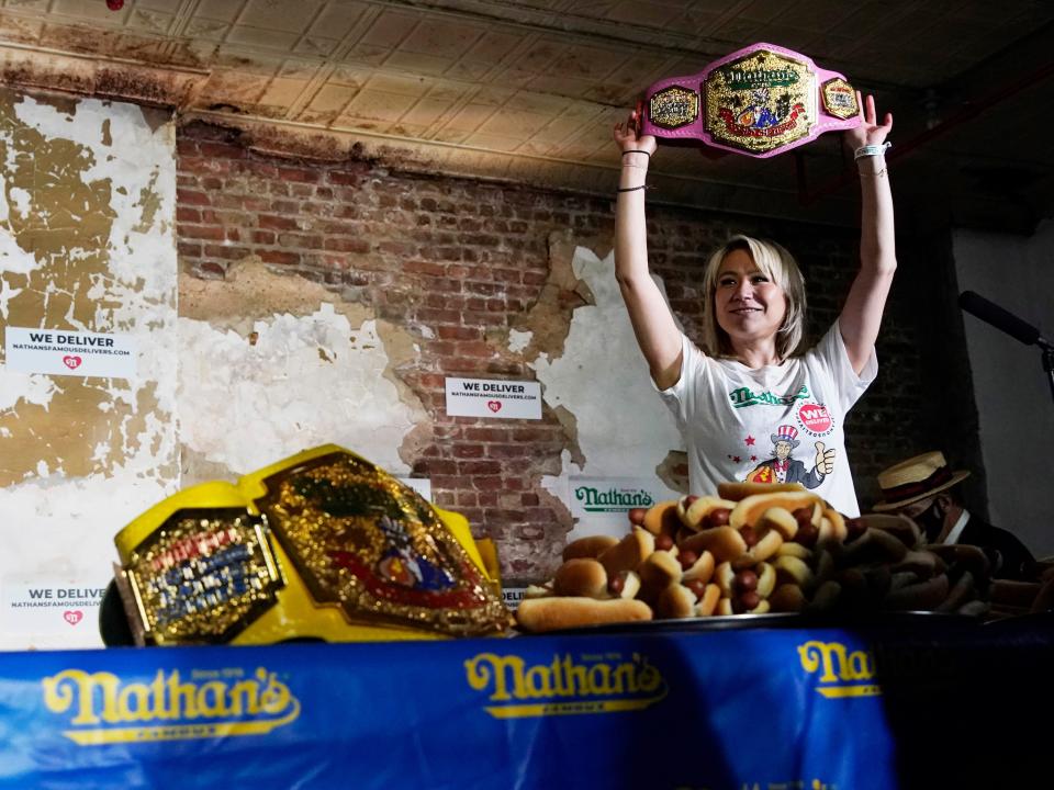 Miki Sudo, the Nathan's Famous Hot Dog Eating Contest champ, poses with her Mustard Belt after her 2020 win.