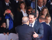 Saad al-Hariri, who announced his resignation as Lebanon's prime minister from Saudi Arabia greets Lebanese President Michel Aoun as he attends a military parade to celebrate the 74th anniversary of Lebanon's independence in downtown Beirut, Lebanon November 22, 2017. REUTERS/Mohamed Azakir