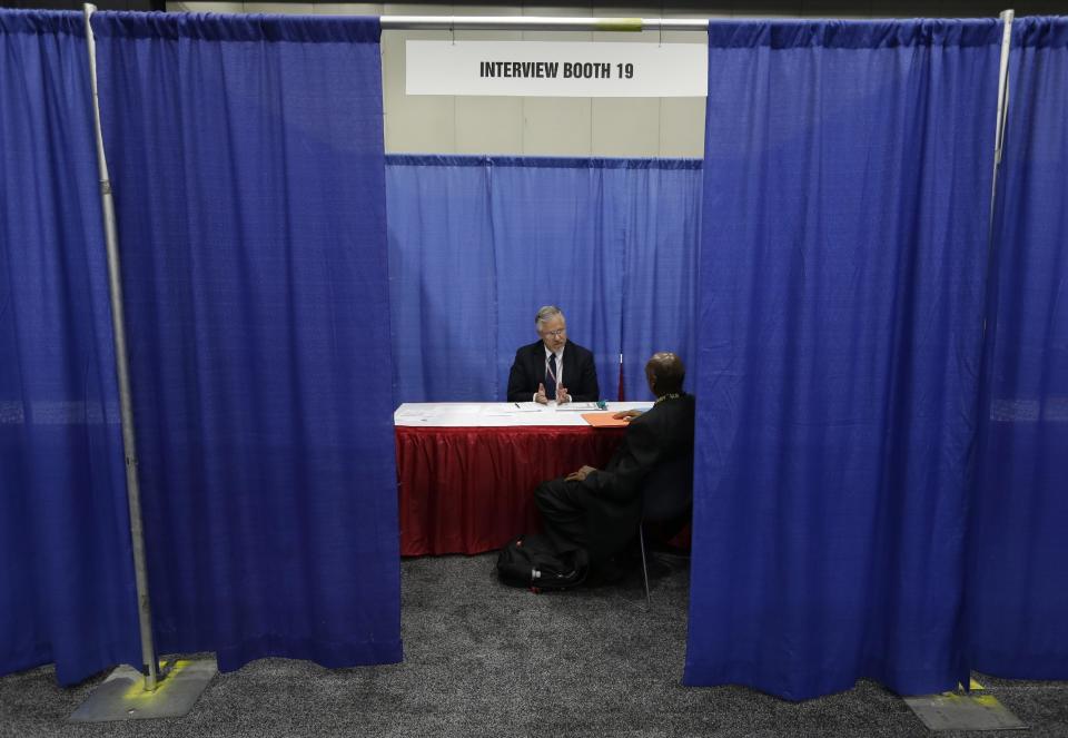 A military veteran receives a job interview in Detroit, Tuesday, June 26, 2012. Thousands of veterans are in Detroit this week for a job fair, open house, and small business conference. (AP Photo/Paul Sancya)