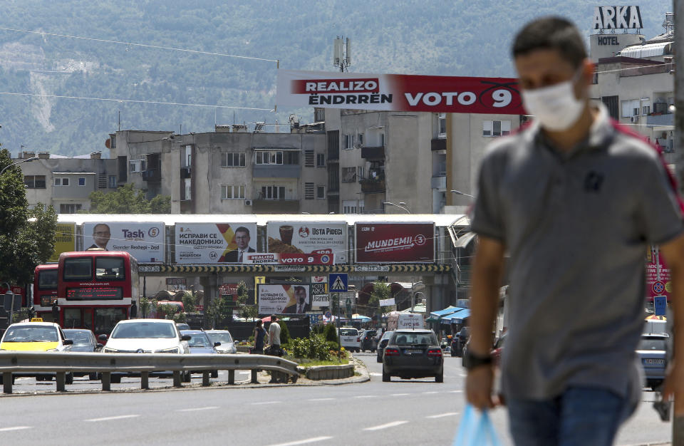 Various electoral campaign posters and banners are displayed over a street in Skopje, North Macedonia on Saturday, July 11, 2020. North Macedonia holds its first parliamentary election under its new country name this week, with voters heading to the polls during an alarming spike of coronavirus cases in the small Balkan nation. (AP Photo/Boris Grdanoski)