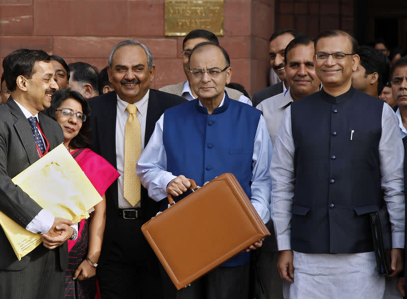 Finance Minister Arun Jaitley (C) poses as he leaves his office to present the 2015/16 budget in New Delhi February 28, 2015. REUTERS/Vijay Mathur