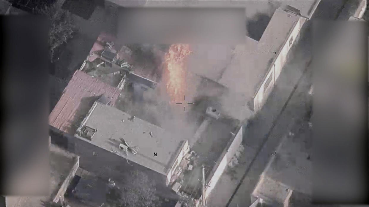 This image from video, released by the Department of Defense, from video footage, shows a fire in the aftermath of a drone strike in Kabul, Afghanistan on Aug. 29, 2021, that killed 10 civilians. It marks the first public release of video footage of the Aug. 29 strike, which the Pentagon initially defended but later called a tragic mistake. Of the 10 people killed in the attack, seven were children. (Department of Defense via AP)