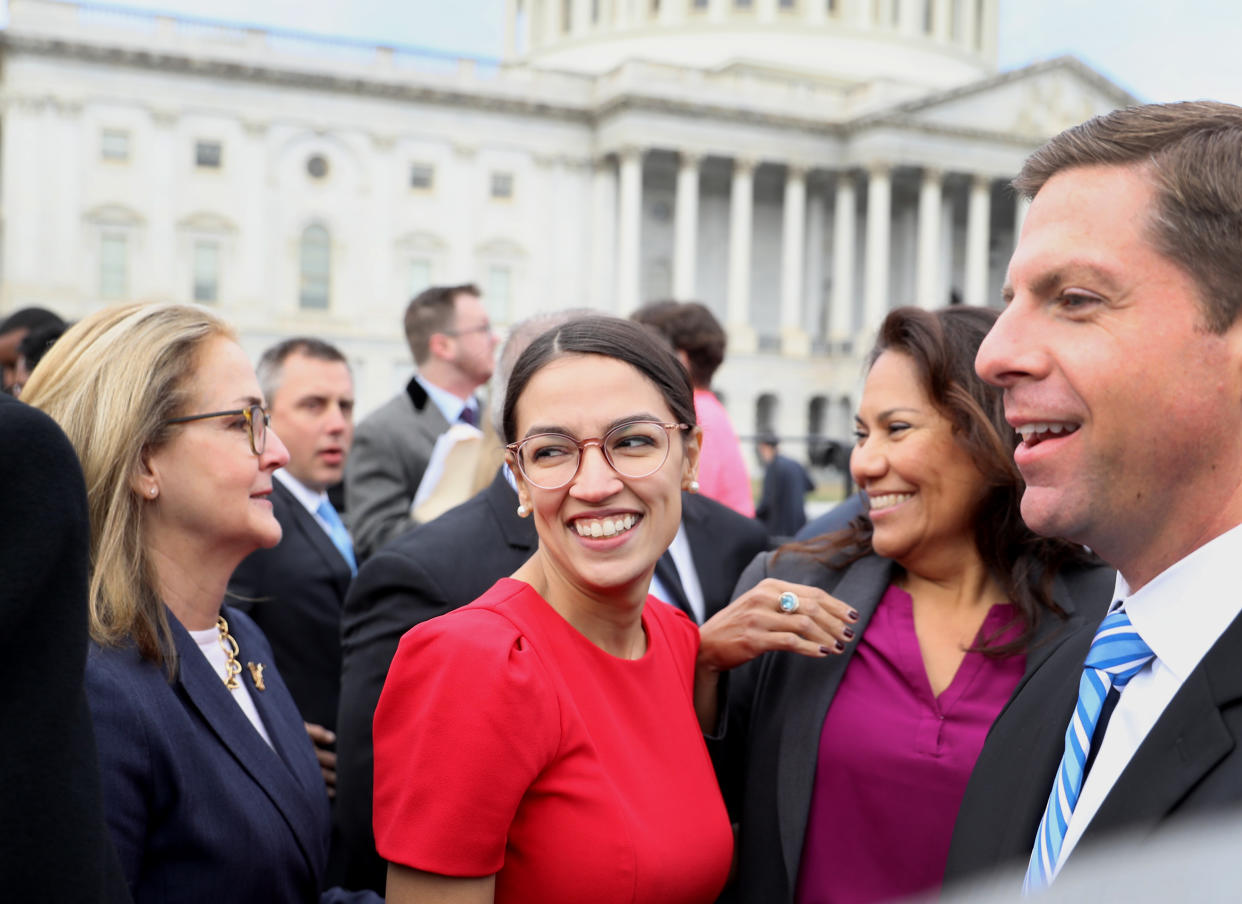 Representative-elect Alexandria Ocasio-Cortez smiles after a group photo with the 116th Congress in Washington, D.C., on Nov. 14, 2018. (Photo: Andrew Harrer/Bloomberg/Getty Images)