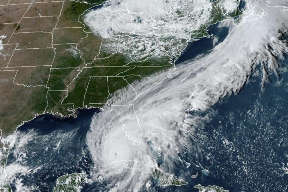 The satellite image shows Hurricane Ian over the Gulf of Mexico.