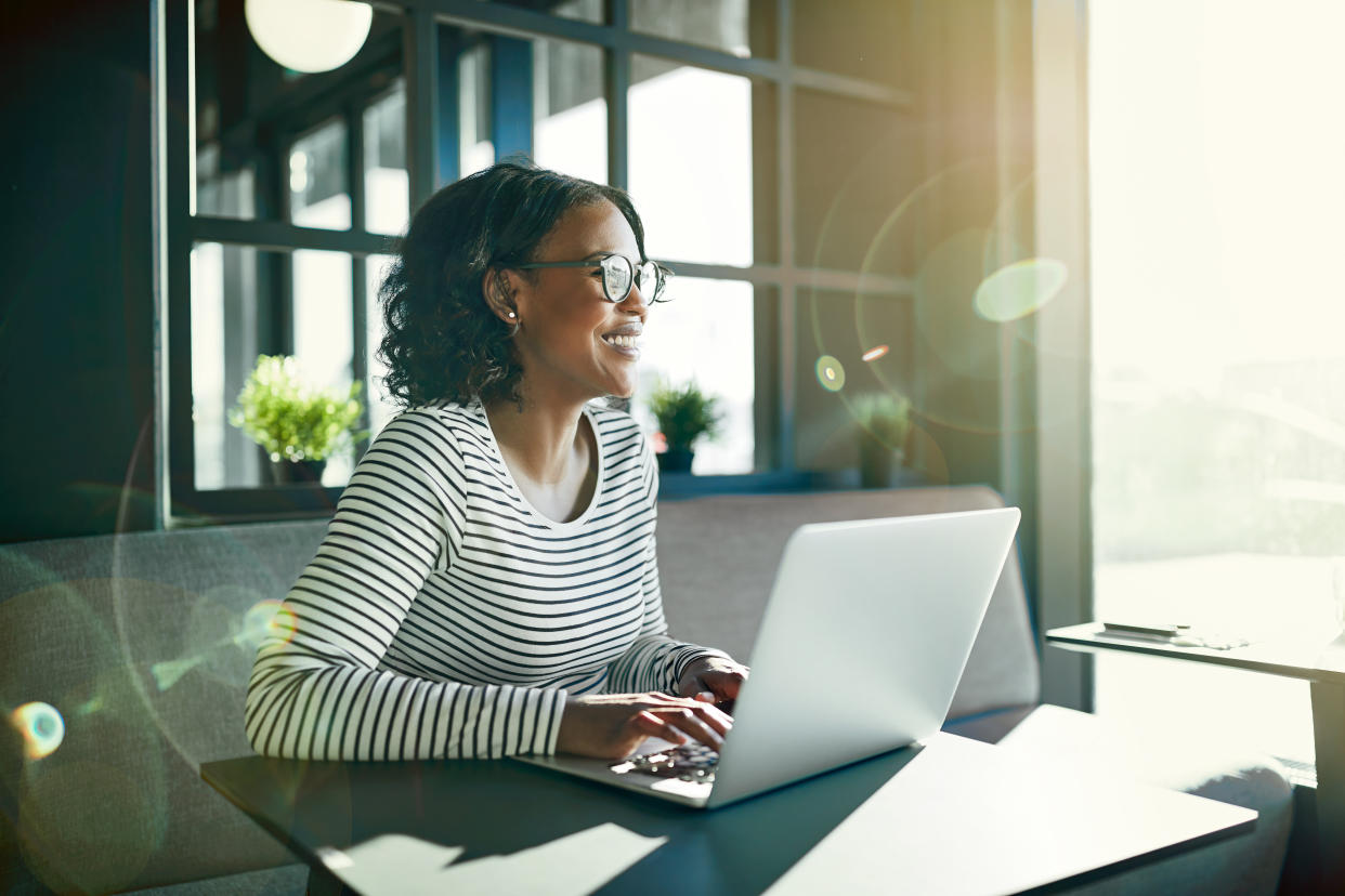 If you have headaches while working near a window, try sitting at a right angle to the glass.  (Photo: FlamingoImages via Getty Images)