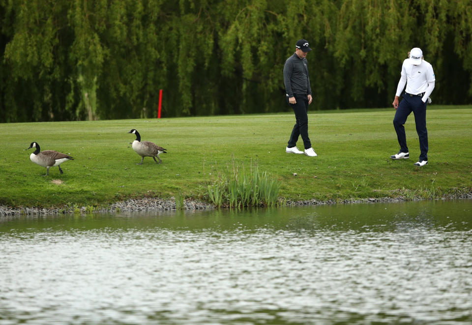 <p>England's Chris Paisley and Australia's Maverick Antcliff search for a ball hit in the lake during day two of the Betfred British Masters at The Belfry, Sutton Coldfield. Picture date: Thursday May 13, 2021.</p>
