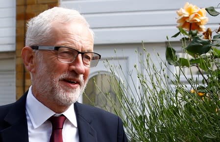 Britain's opposition Labour Party leader Jeremy Corbyn leaves his home in London