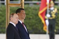 Chinese President Xi Jinping, right, and Russian President Vladimir Putin attend an official welcome ceremony in Beijing, China, on Thursday, May 16, 2024. (Sergei Bobylev, Sputnik, Kremlin Pool Photo via AP)