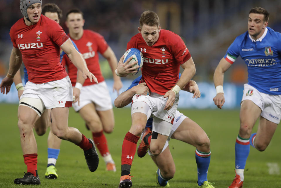 Wales' Liam Williams, foreground, is tackled by Italy's Luca Morisi during the Six Nations rugby union international between Italy and Wales, at Rome's Olympic Stadium, Saturday, Feb. 9, 2019. (AP Photo/Andrew Medichini)