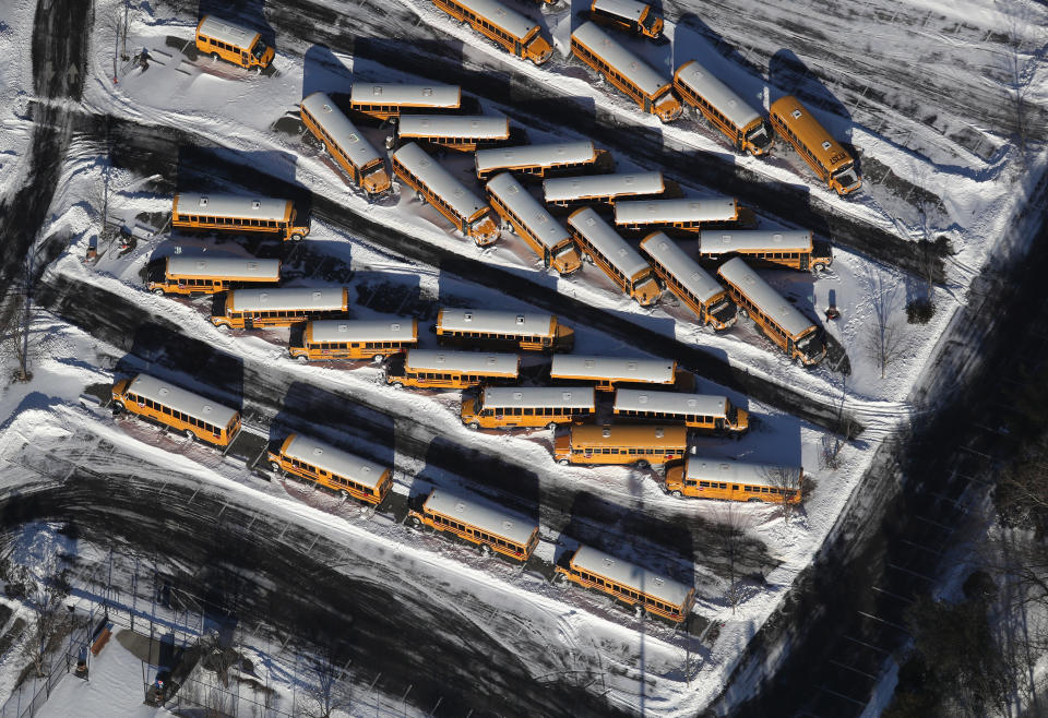 School busses sit covered in snow on January 5, 2018 near White Plains, New York.&nbsp;