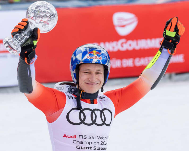 Switzerland's Marco Odermatt celebrates with the trophy after winning the men's giant slalom during the FIS Ski Alpine World Cup. Expa/Johann Groder/APA/dpa