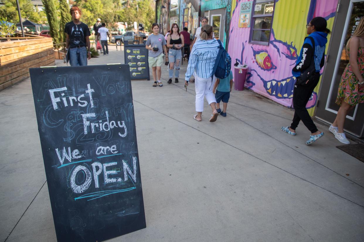 People enjoyed a hot evening in Railroad Square as they supported local businesses following the tornadoes that tore through Tallahassee on May 10, during the monthly event, First Friday on June 7, 2024.