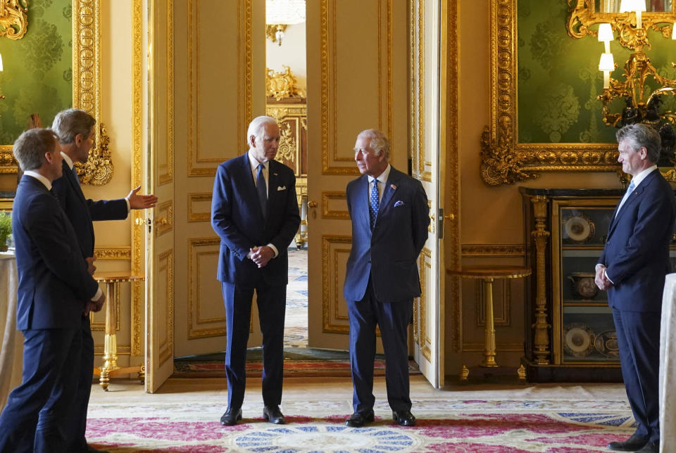 US Special Presidential Envoy for Climate John Kerry, second left, speaks to U.S. President Joe Biden, centre left and Britain's King Charles III during a climate engagement with philanthropists and investors at Windsor Castle, in Windsor, England, Monday, July 10, 2023. (Kevin Lamarque/Pool Photo via AP)
