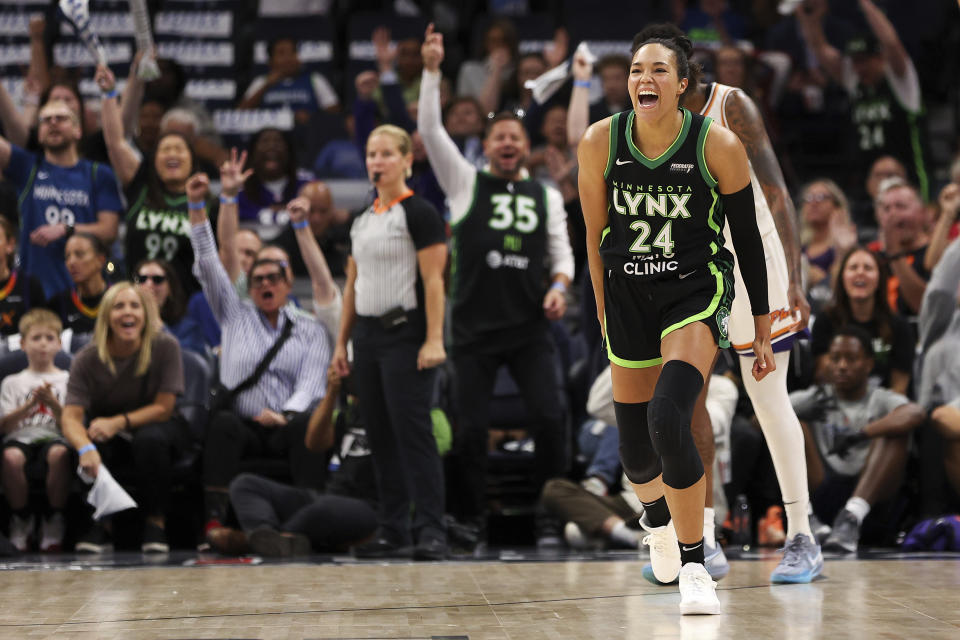 Minnesota Lynx forward Napheesa Collier celebrates her 3-point basket against the Phoenix Mercury during the second half of Game 1 of a WNBA basketball first-round playoff game, Sunday, Sept. 22, 2024, in Minneapolis. (AP Photo/Matt Krohn)