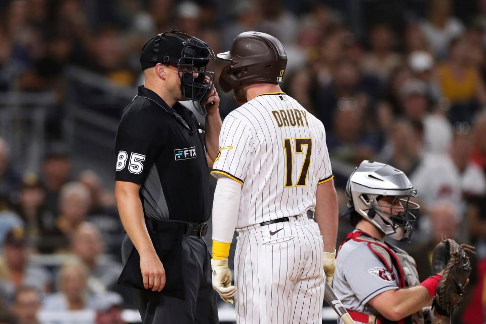 San Diego Padres' Brandon Drury (17) argues with home plate umpire Stu Scheurwater (85) after striking out against the Cleveland Guardians in the fourth inning of a baseball game Tuesday, Aug. 23, 2022, in San Diego. Drury was ejected from the game. (AP Photo/Derrick Tuskan)