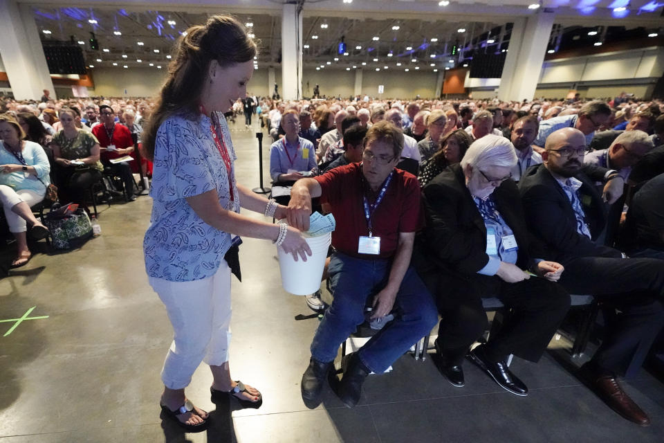 Votes are collected on the first ballot for president of the Southern Baptist Convention during the denomination's annual meeting Tuesday, June 15, 2021, in Nashville, Tenn. (AP Photo/Mark Humphrey)