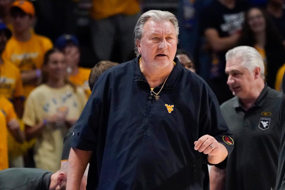 West Virginia head coach Bob Huggins talks to his team during the first half of an NCAA college basketball game against Pittsburgh, Friday, Nov. 11, 2022, in Pittsburgh. (AP Photo/Keith Srakocic)