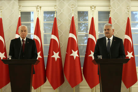 Turkish Prime Minister Binali Yildirim and opposition Nationalist Movement Party (MHP) leader Devlet Bahceli hold a news conference after their meeting in Ankara, Turkey, December 1, 2016. Mustafa Aktas/Prime Minister's Press Office/Handout via REUTERS