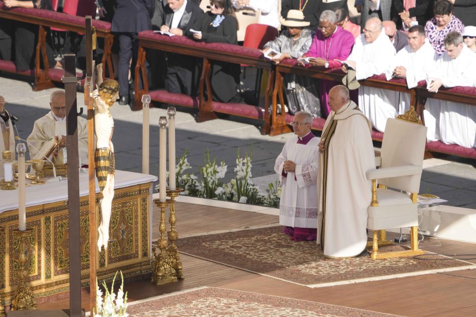 Pope Francis presides a mass concelebrated by the new cardinals for the start of the XVI General Assembly of the Synod of Bishops in St. Peter's Square at The Vatican, Wednesday, Oct.4, 2023. Pope Francis is convening a global gathering of bishops and laypeople to discuss the future of the Catholic Church, including some hot-button issues that have previously been considered off the table for discussion. Key agenda items include women's role in the church, welcoming LGBTQ+ Catholics, and how bishops exercise authority. For the first time, women and laypeople can vote on specific proposals alongside bishops (AP Photo/Andrew Medichini)