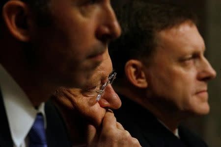 U.S. Defence Undersecretary for Intelligence Marcel Lettre (L-R), Director of National Intelligence James Clapper and National Security Agency Director U.S. Navy Admiral Michael Rogers testify before a Senate Armed Services Committee hearing on foreign cyber threats, on Capitol Hill in Washington, U.S. January 5, 2017. REUTERS/Jonathan Ernst