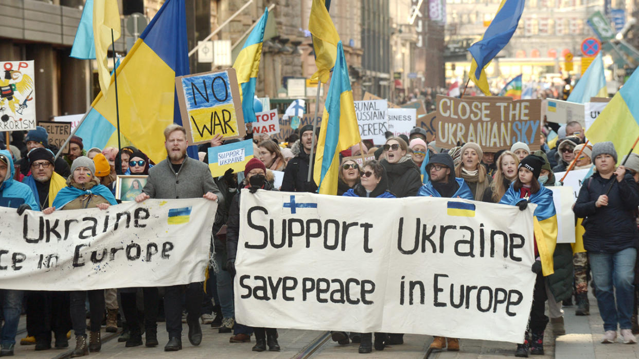 Protesters demonstrate against Russia's invasion of Ukraine at a rally in Helsinki, Finland.