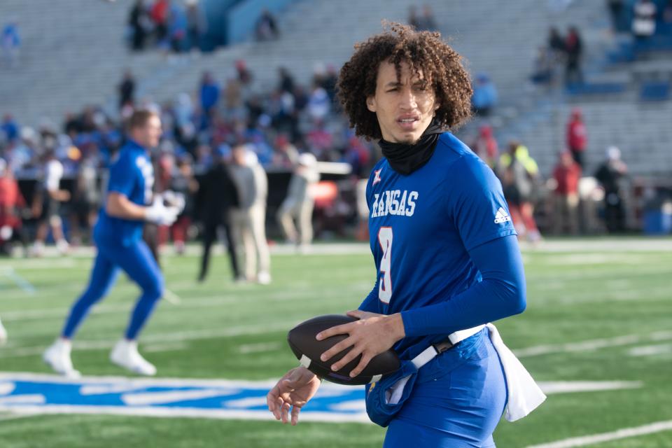 Kansas redshirt senior quarterback Jason Bean (9) comes onto the field for pregame before a game earlier this year against Oklahoma inside David Booth Kansas Memorial Stadium.