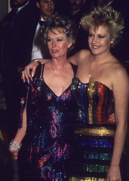 <p>Tippi Hedren and Melanie Griffith in coordinated rainbow shimmer gowns. </p>