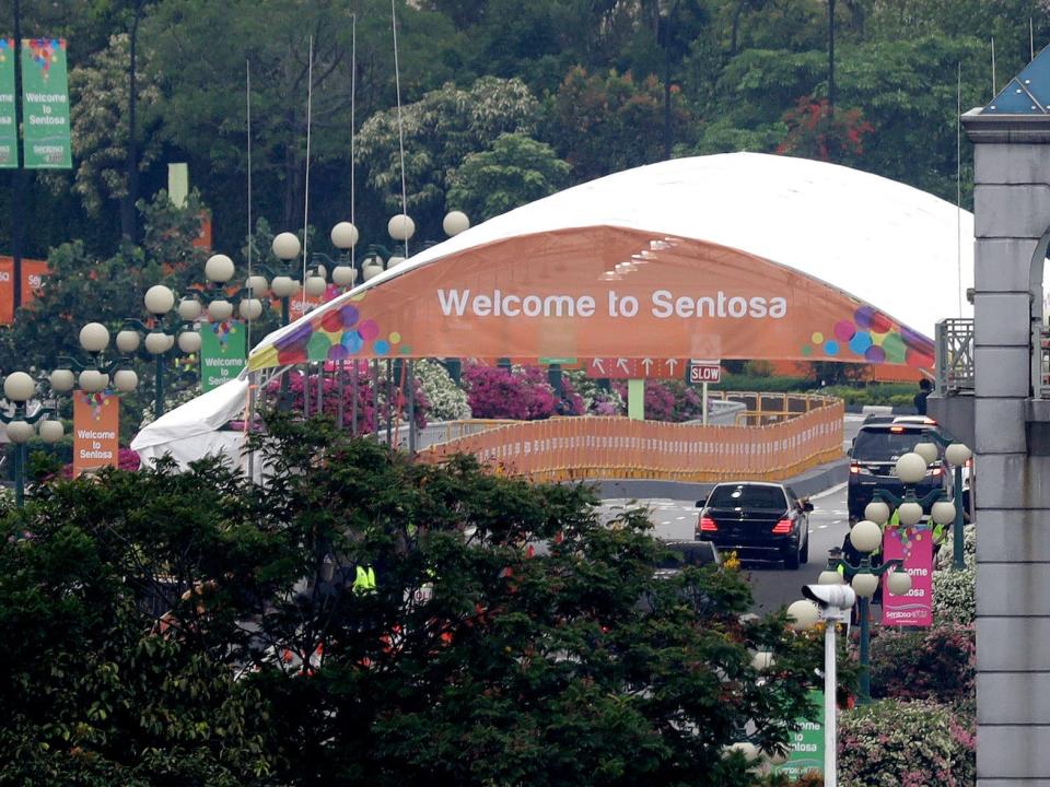 Seen from the Bay Hotel in Singapore, a car carrying North Korean leader Kim Jong Un enters Sentosa island.