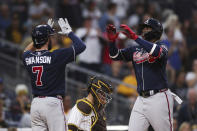 Atlanta Braves' Jorge Soler, right, is congratulated by Dansby Swanson (7) after hitting a three-run home run against the San Diego Padres in the sixth inning of a baseball game Saturday, Sept. 25, 2021, in San Diego. (AP Photo/Derrick Tuskan)