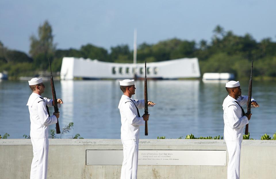 The U.S. Navy Ceremonial Guard performs a rifle salute at the Arizona Memorial during the 72nd anniversary of the attack on Pearl Harbor at the WW II Valor in the Pacific National Monument in Honolulu, Hawaii on December 7, 2013. (REUTERS/Hugh Gentry)