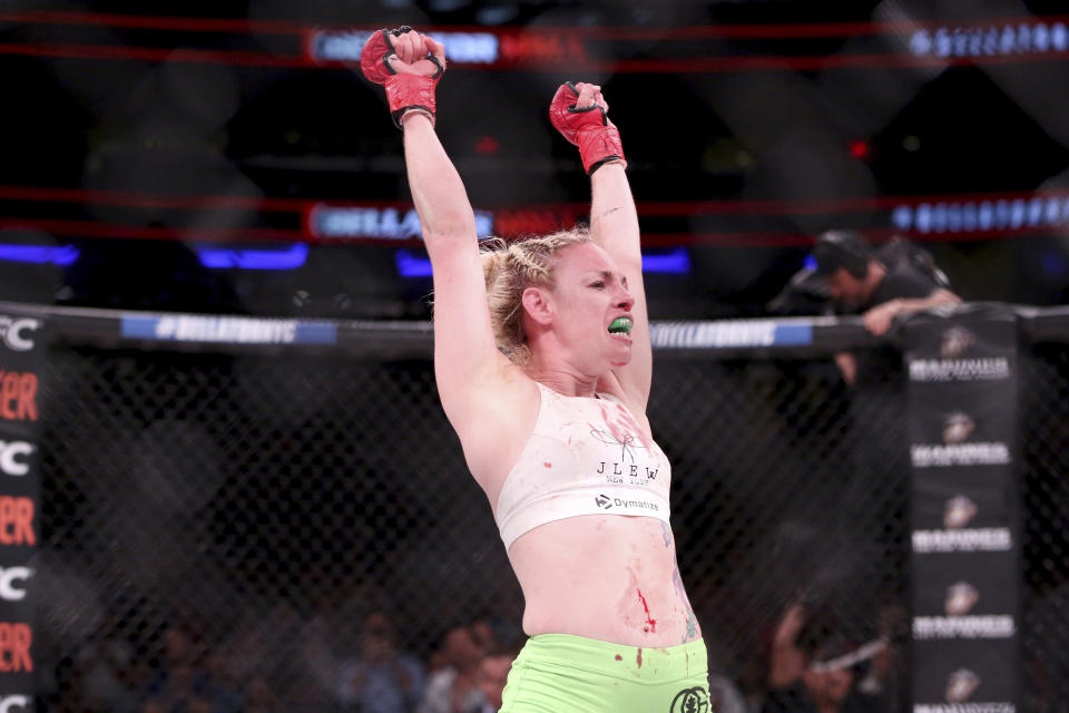 Heather Hardy celebrates a win against Alice Yauger in a mixed martial arts bout at Bellator 180. (AP)