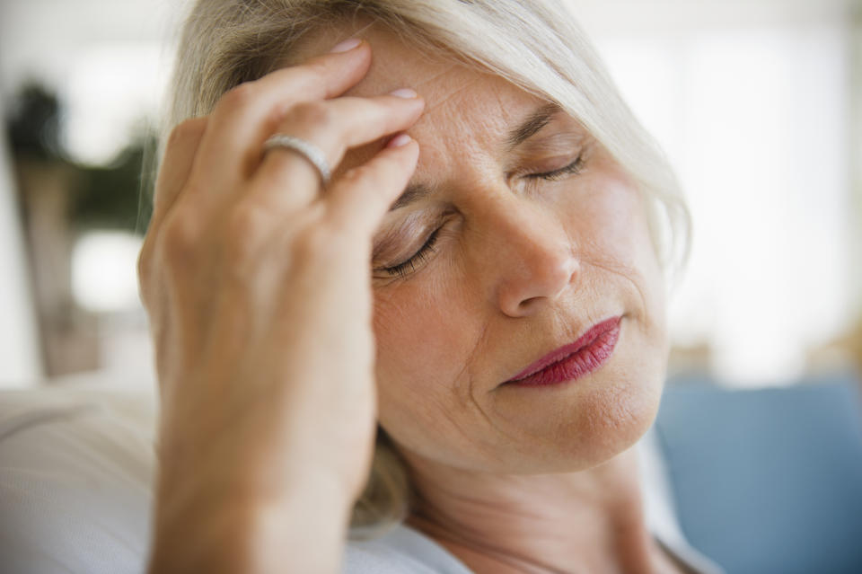 Woman with headache. (Getty Images)