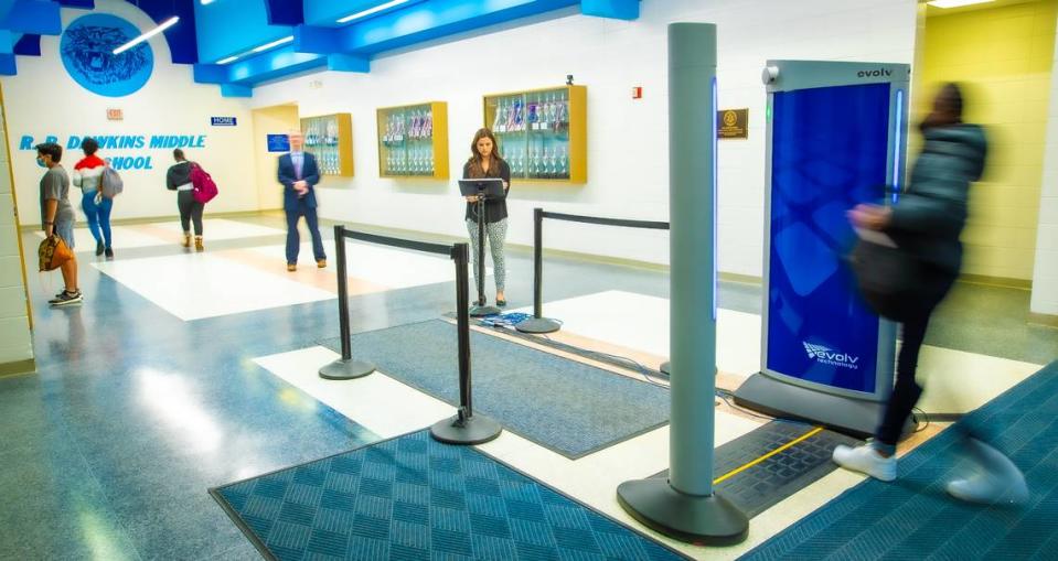 As students walk through the body scanner at R.P. Dawkins Middle School in Spartanburg, S.C. CMS officials consulted the Spartanburg district before implementing their own scanners.