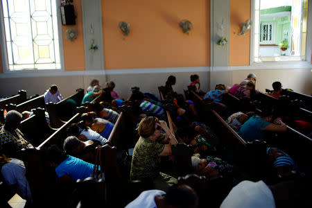 Worshippers attend a prayer service at a Methodist Church in Havana, Cuba, October 2, 2018. REUTERS/Alexandre Meneghini