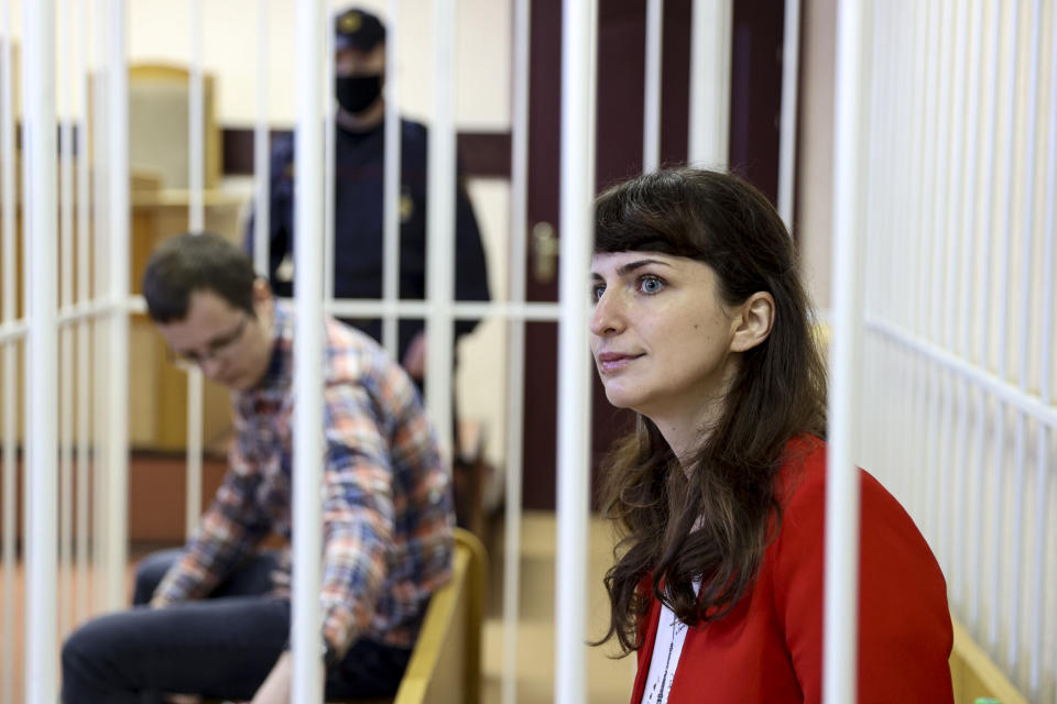 Belarusian journalist Katsiaryna Barysevich, right, and Dr. Artom Sorokin attend a court hearing in Minsk, Belarus, Friday, Feb. 19, 2021. Barysevich is accused of revealing personal data in her report on the death of a protester, part of the Belarusian authorities to stifle independent media reports about protests against authoritarian President Alexander Lukashenko.Amnesty International has declared Barysevich and Sorokin prisoners of conscience. (Ramil Nasibulin/BelTA pool photo via AP)