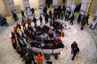 <p>Police arrest immigration activists conducing an act of civil disobediance in the rotunda of the Russell Senate Office Building on Feb. 7, 2018 in Washington D.C. (Photo: John Moore/Getty Images) </p>