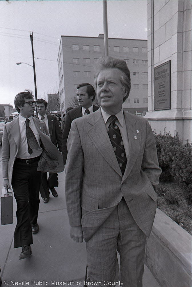 In this photo taken by a Green Bay Press-Gazette photographer, Jimmy Carter, then the former Georgia governor, walks in front of the Press-Gazette on March 26, 1976, during the primary campaign against U.S. Rep. Morris King Udall.